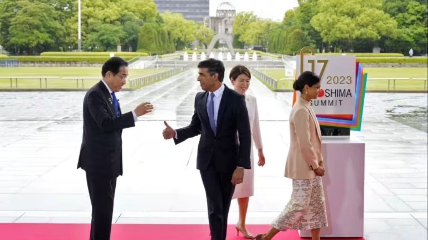 Japanese Prime Minister Fumio Kishida, left, and British Prime Minister Rishi Sunak at Peace Memorial Park in Hiroshima, Japan in May 2023.