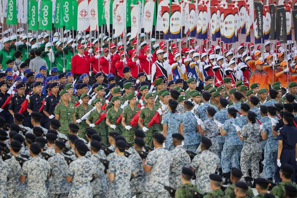 Besides uniformed groups, contingents from social and economic groups also made their appearance at the parade.  ST PHOTO: GIN TAY
