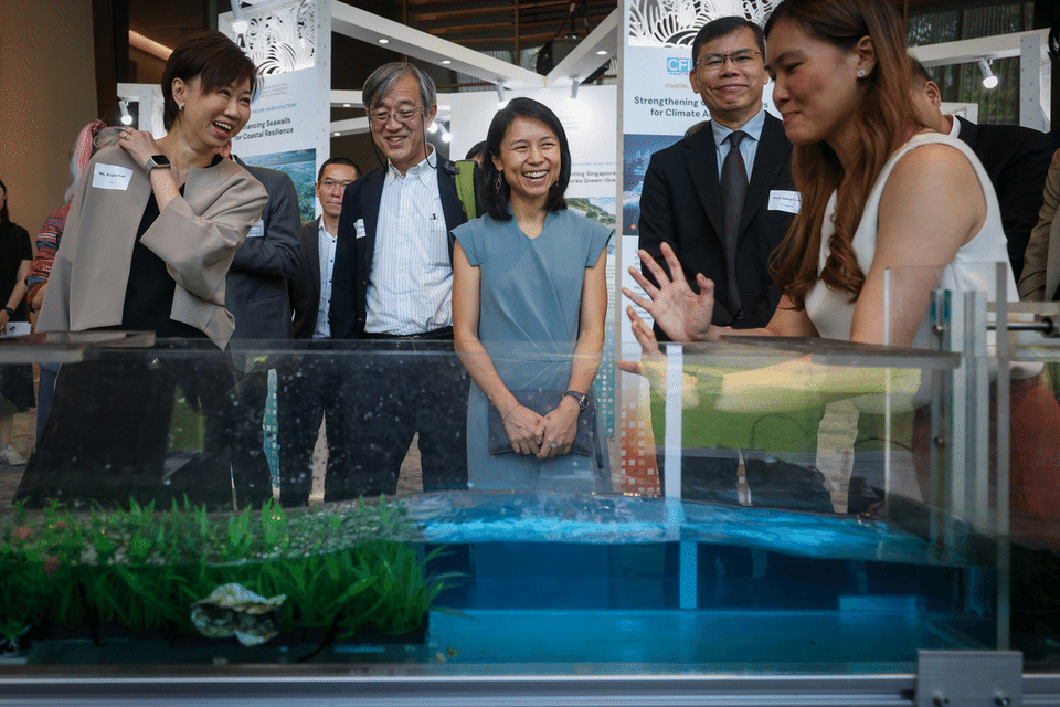 Senior Parliamentary Secretary for Sustainability and the Environment Goh Hanyan (centre) at the CFI Symposium in NUS on Sept 18.  ST PHOTO: JASON QUAH