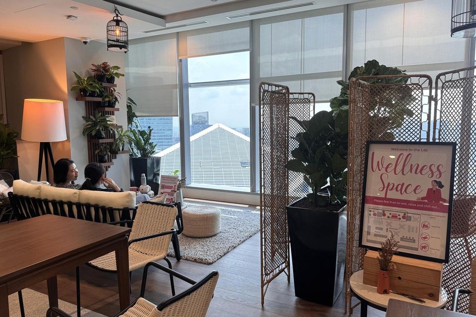 DBS Bank employees can recharge at wellness zones that feature comfy couches and indoor plants. Folding screens are added to create a sense of privacy.  ST PHOTO: CHEONG POH KWAN