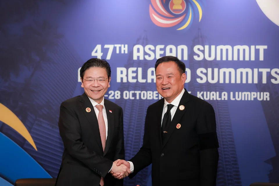 PM Lawrence Wong (left) meeting his Thai counterpart, Mr Anutin Charnvirakul, on the sidelines of the Asean Summit in Kuala Lumpur on Oct 27.  ST PHOTO: GAVIN FOO
