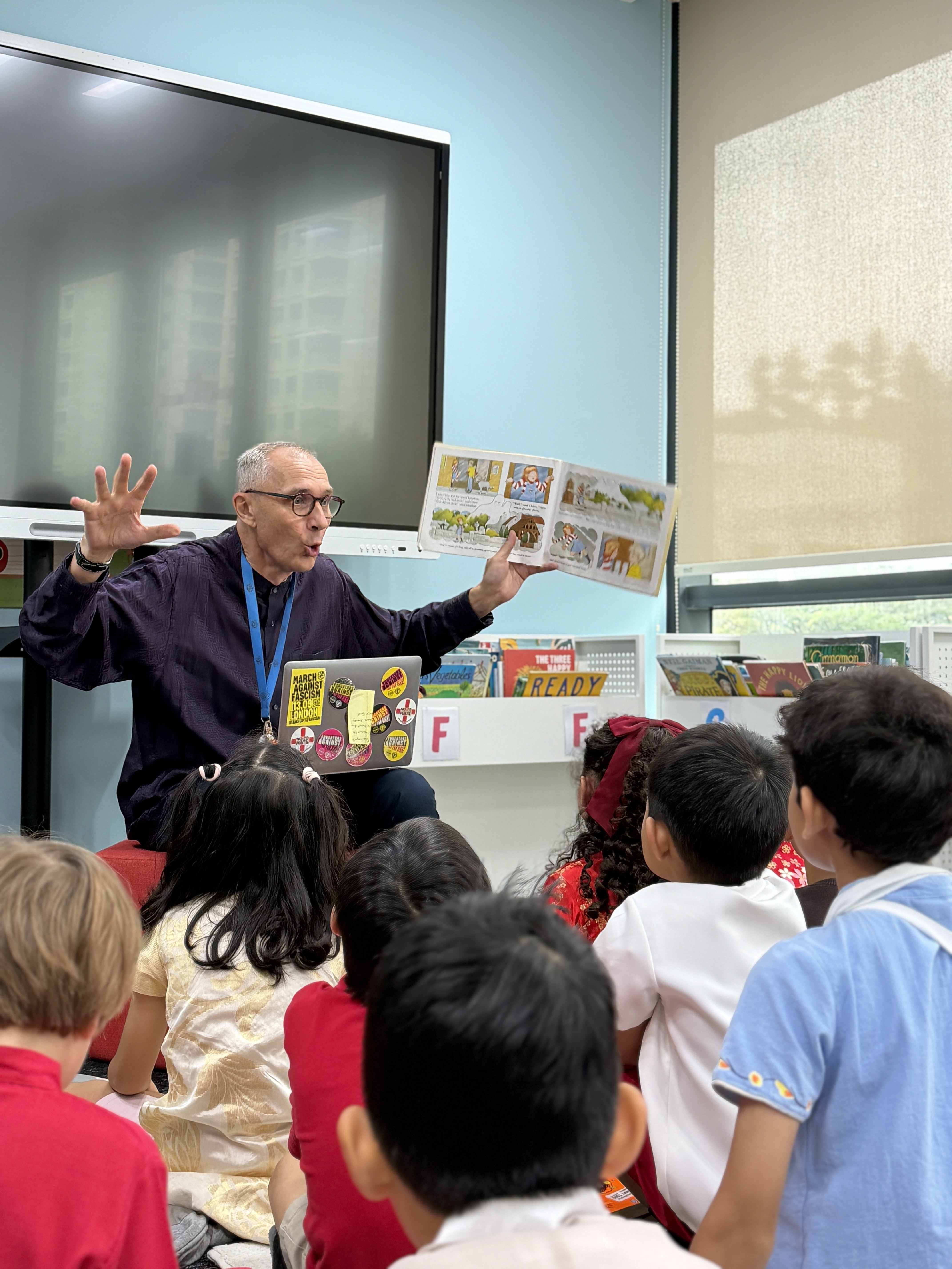 Mr Guy reading to students in the Junior School Library