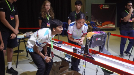 MercuriX Racing team member in action during a head-to-head race at the STEM Racing Singapore Nationals 2025