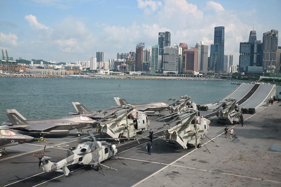 British F-35B fighter jets and Royal Navy Merlin helicopters on the flight deck of the British aircraft carrier HMS Prince of Wales docked at the Marina Bay Cruise Centre on June 24.ST PHOTO: CHONG JUN LIANG