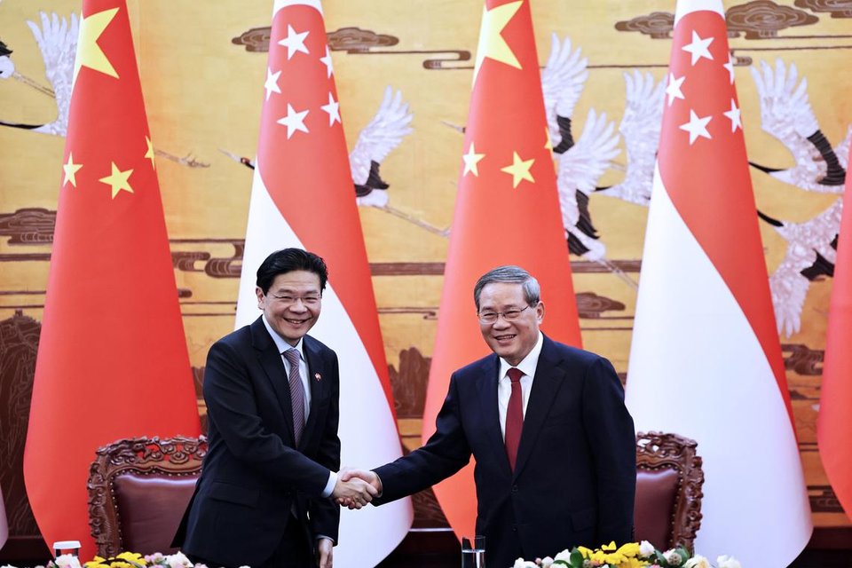 PM Lawrence Wong meeting Chinese Premier Li Qiang (right) in Beijing on June 23.ST PHOTO: KELVIN CHNG