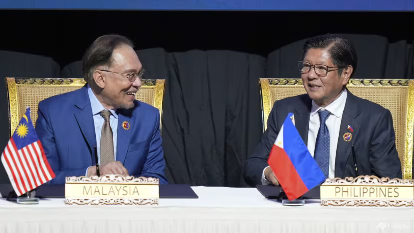 Malaysia's Prime Minister Anwar Ibrahim (left), and Philippine President Ferdinand Marcos Jr attend a signing ceremony of the Kuala Lumpur Declaration on ASEAN 2045: Our Shared Future at the Association of Southeast Asian Nations (ASEAN) Summit in Kuala Lumpur on May 26, 2025. (Photo: AP/Vincent Thian)